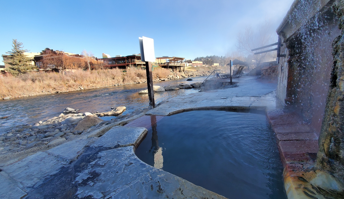Water fall filling the pool next to the San Juan River