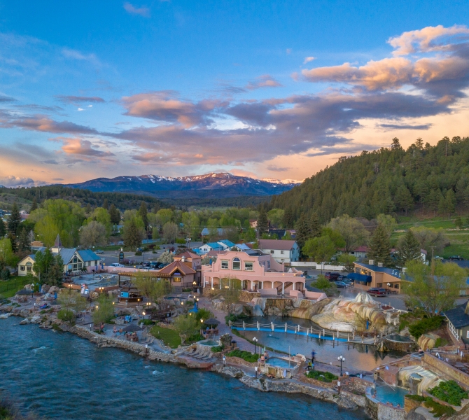 An aerial view of The Springs Resort at sunset