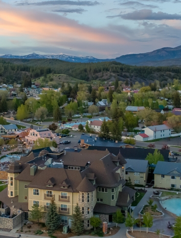 An aerial view of The Springs Resort at sunset